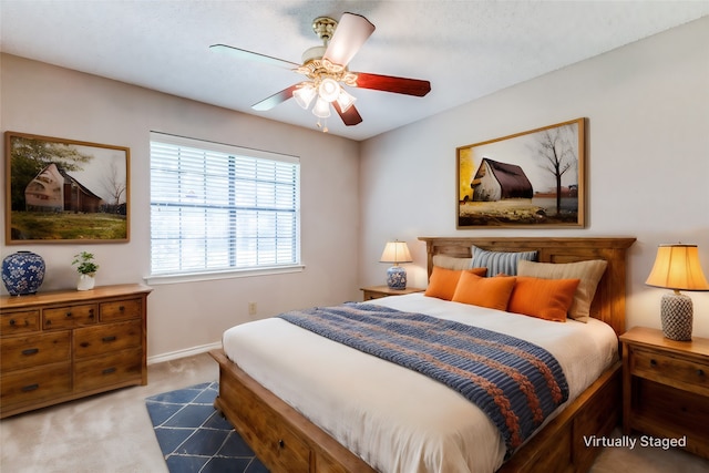 carpeted bedroom featuring ceiling fan