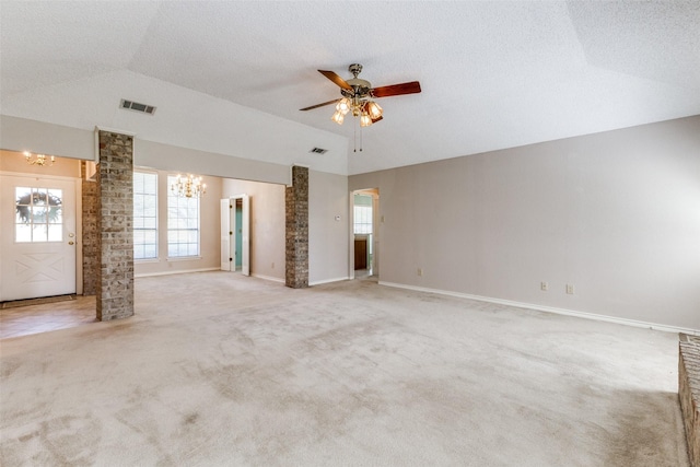 spare room with light carpet, ornate columns, a textured ceiling, vaulted ceiling, and ceiling fan