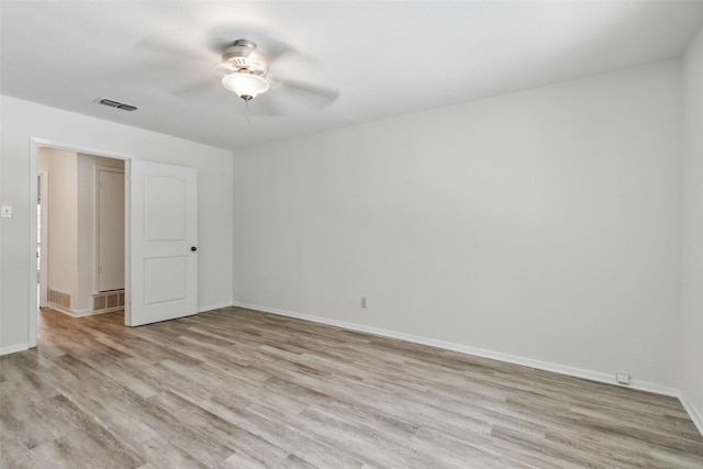 unfurnished room featuring ceiling fan and light wood-type flooring