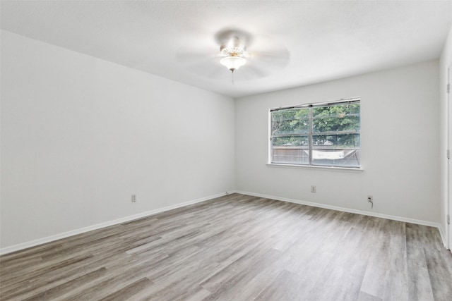 unfurnished room featuring ceiling fan and light wood-type flooring