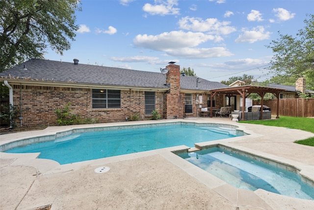 view of pool with a gazebo, a patio area, an in ground hot tub, and area for grilling