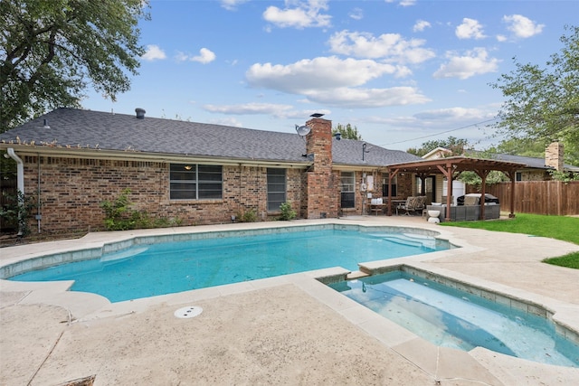 view of pool featuring a pergola, a patio area, and an in ground hot tub