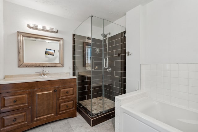 bathroom featuring vanity, tile patterned flooring, and plus walk in shower