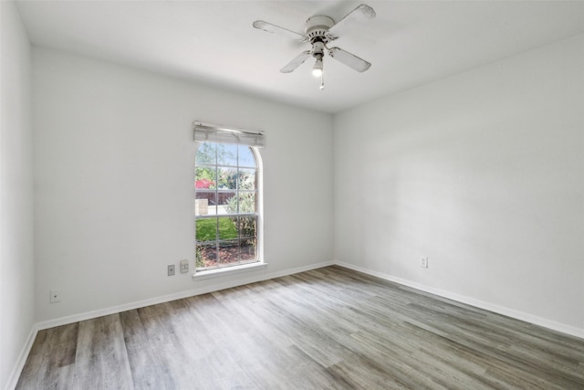 unfurnished room featuring hardwood / wood-style flooring and ceiling fan