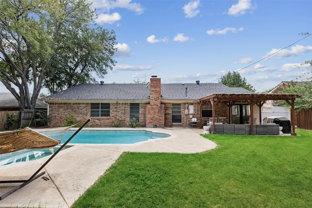 view of pool featuring an outdoor hangout area, a patio, and a lawn