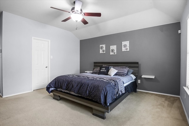 bedroom with carpet, vaulted ceiling, and ceiling fan