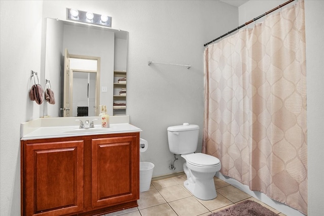 bathroom with a shower with curtain, tile patterned flooring, vanity, and toilet