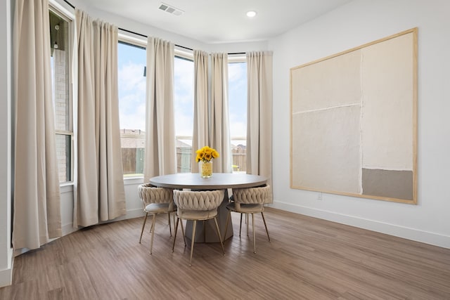 dining space featuring hardwood / wood-style flooring