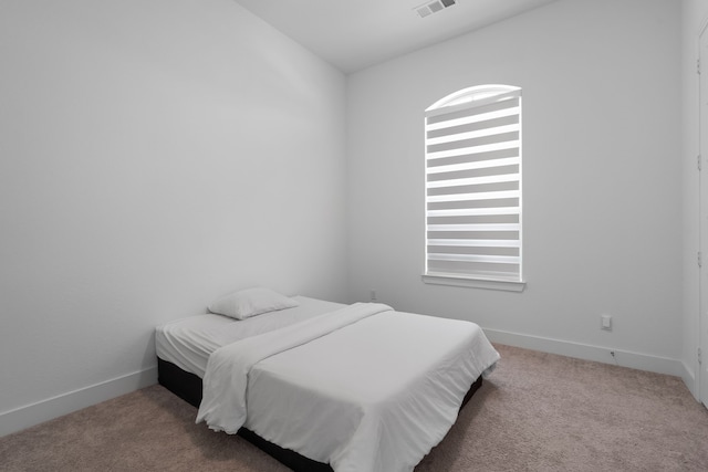 bedroom featuring carpet