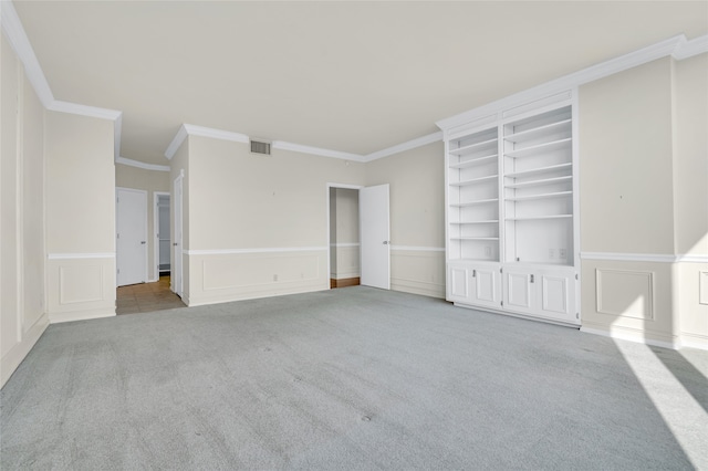 unfurnished room with light colored carpet and ornamental molding