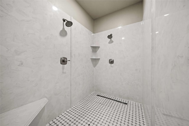 bathroom with tiled shower