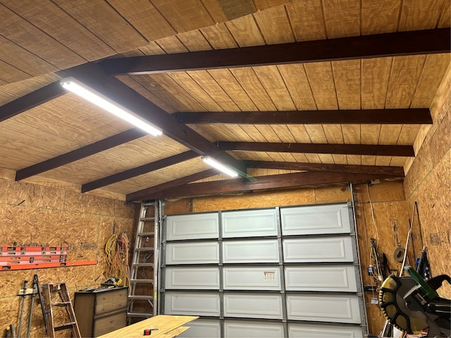 garage featuring wood walls