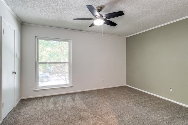 carpeted spare room featuring a textured ceiling, ceiling fan, and crown molding