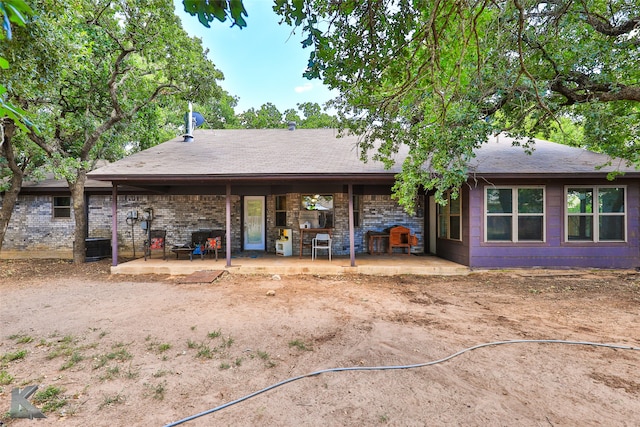 rear view of property with a patio