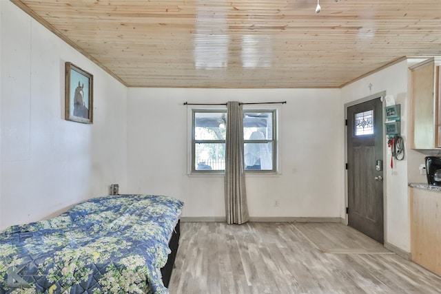 bedroom with light wood-type flooring and wooden ceiling