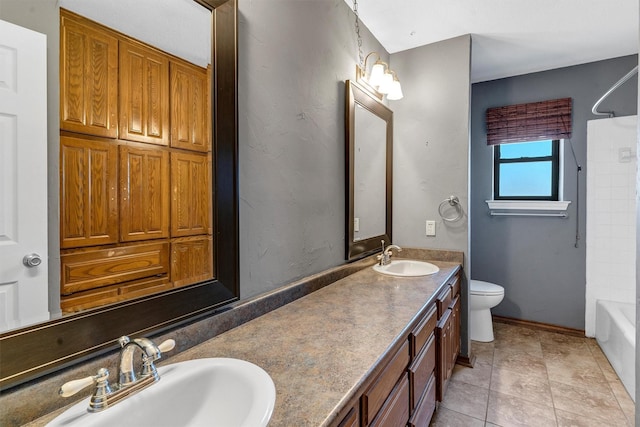 full bathroom featuring shower / tub combination, vanity, tile patterned floors, and toilet