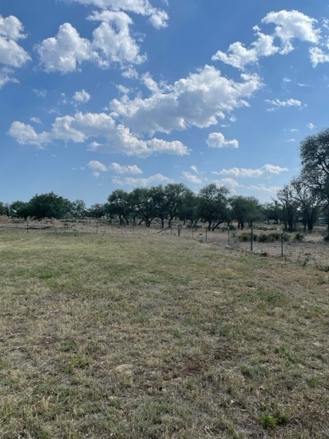 view of yard with a rural view