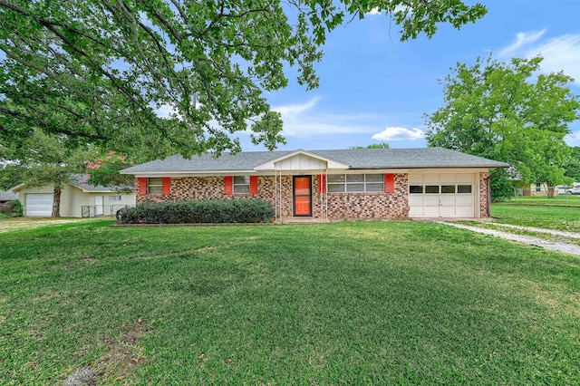 ranch-style house with a garage and a front lawn