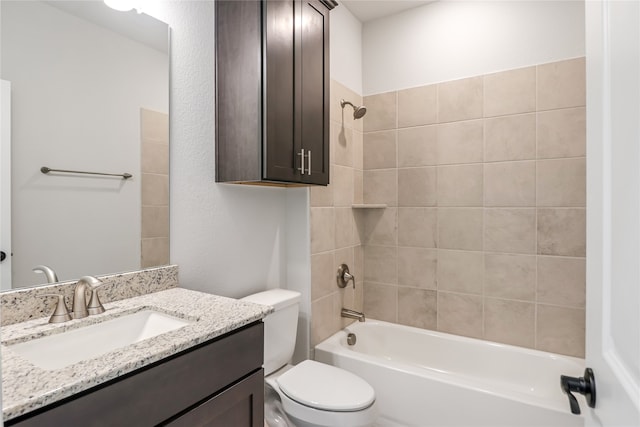 full bathroom featuring vanity, toilet, and tiled shower / bath