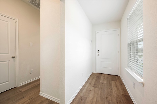 corridor featuring light hardwood / wood-style floors