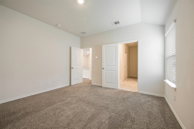 unfurnished bedroom featuring multiple windows and light carpet