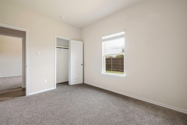 unfurnished bedroom with carpet floors