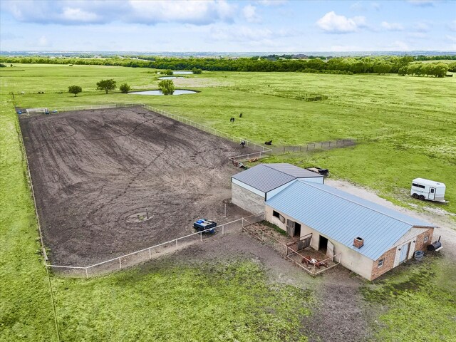 birds eye view of property featuring a rural view