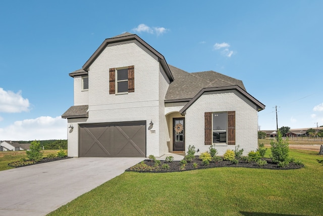 view of front of house with a garage and a front lawn