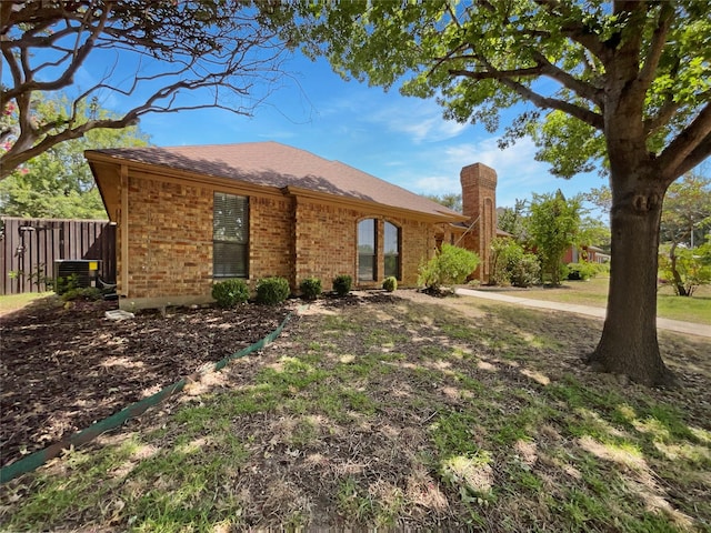 ranch-style house with central AC unit