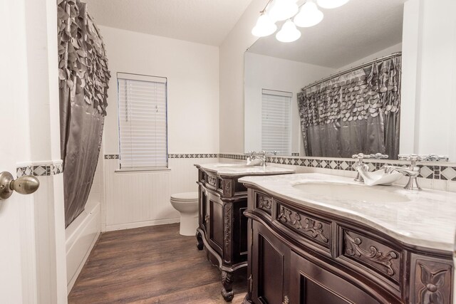 spare room with ceiling fan, hardwood / wood-style flooring, and vaulted ceiling