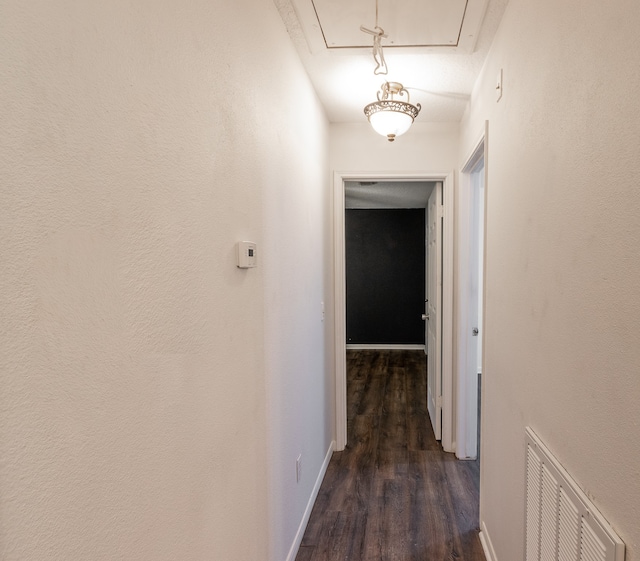 corridor featuring dark hardwood / wood-style floors