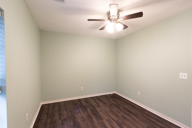 spare room with a textured ceiling, ceiling fan, and wood-type flooring