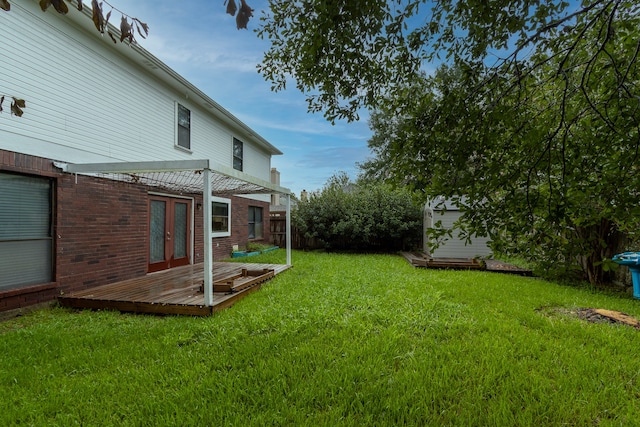 view of yard with a pergola and a deck