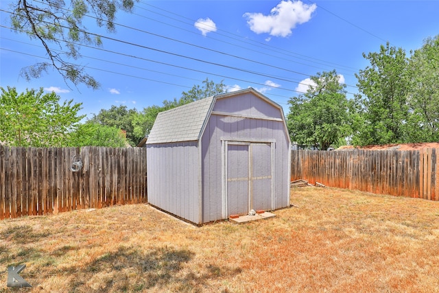 view of outdoor structure featuring a lawn