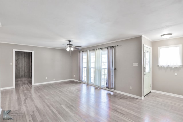 spare room featuring ceiling fan, crown molding, and light hardwood / wood-style flooring