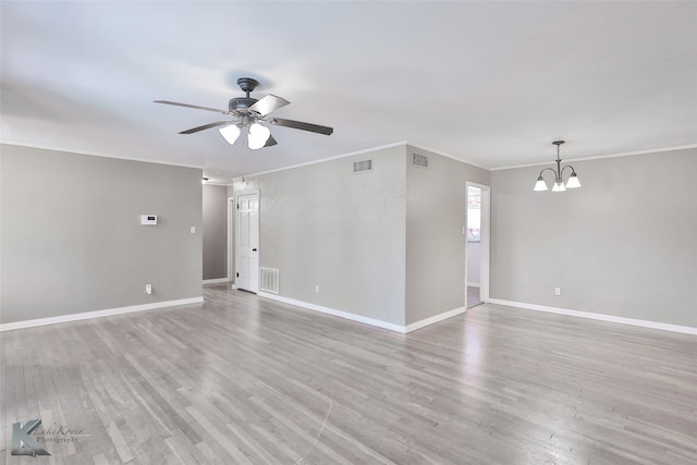 spare room featuring light wood-type flooring, crown molding, and ceiling fan with notable chandelier