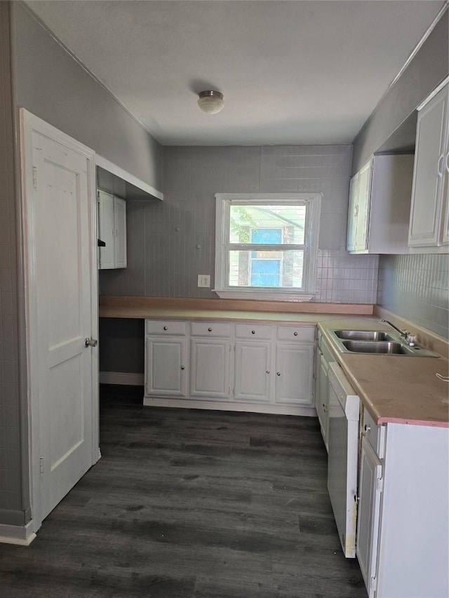 kitchen featuring white cabinetry, sink, dark hardwood / wood-style floors, and dishwasher