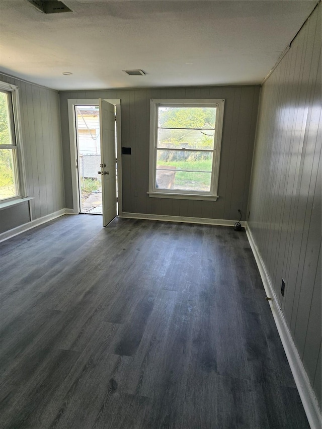 unfurnished room featuring dark hardwood / wood-style floors