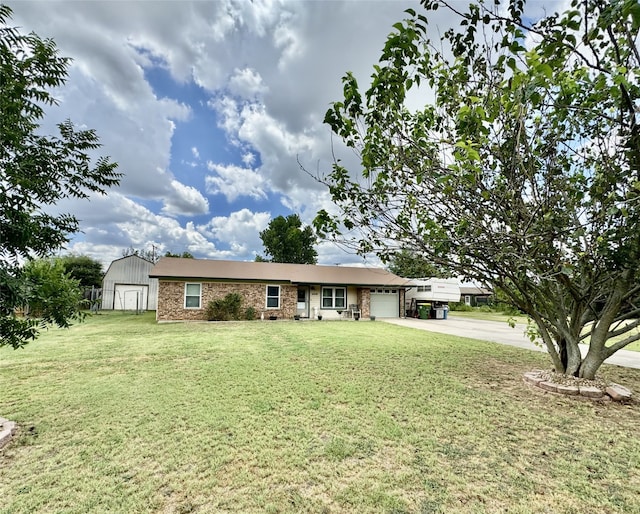 ranch-style home with a garage, a front lawn, and a shed