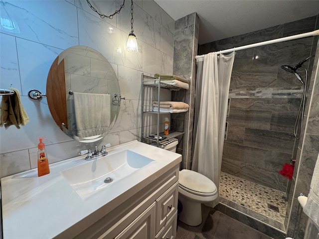 4506 Azalea Dr, Granbury, TX 76049 - bathroom with tile walls, vanity, a tile shower, and toilet