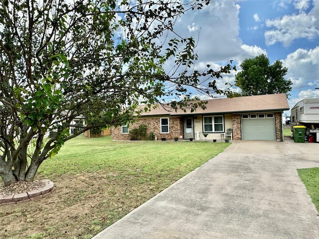 single story home with a garage and a front lawn