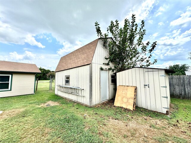 view of outbuilding with a yard