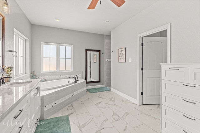 bathroom featuring vanity, tile patterned floors, ceiling fan, and a relaxing tiled tub