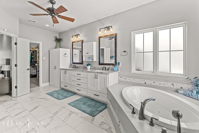 bathroom featuring double vanity, tile patterned floors, a wealth of natural light, and ceiling fan