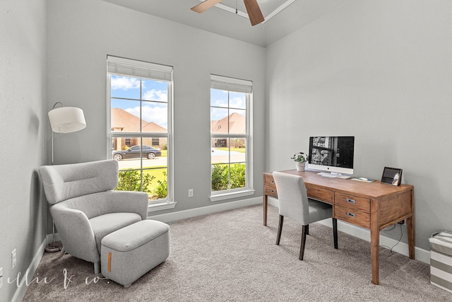 carpeted office space with ceiling fan