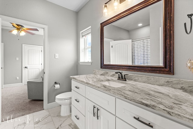 bathroom featuring vanity, ceiling fan, toilet, and tile patterned floors