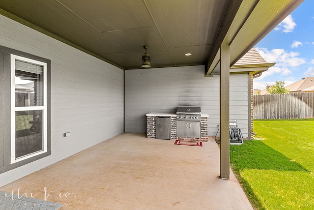 view of patio featuring a grill