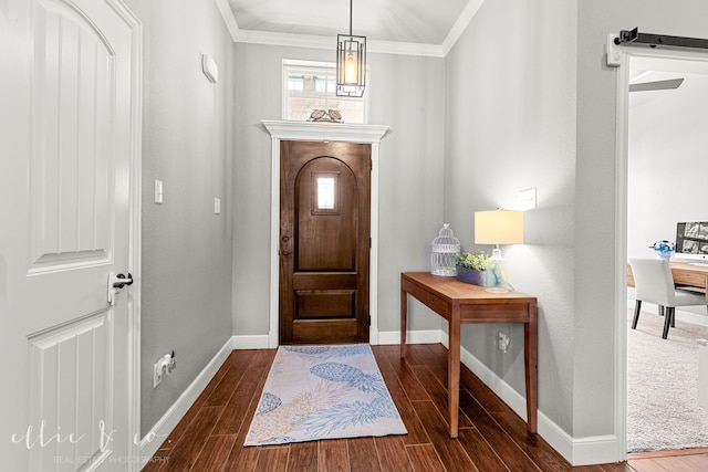 entryway featuring ornamental molding and dark hardwood / wood-style floors