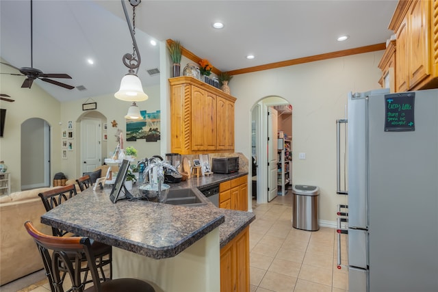 kitchen featuring light tile patterned flooring, white fridge, decorative light fixtures, and ceiling fan