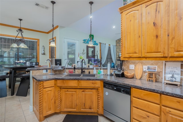 kitchen featuring kitchen peninsula, tasteful backsplash, sink, and stainless steel dishwasher